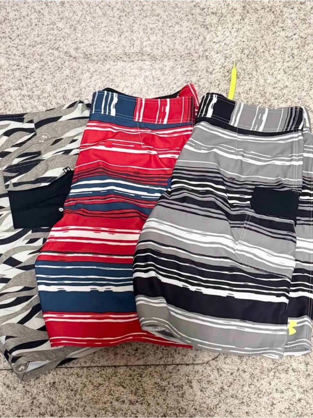3 men’s Under Armour swim suits size 36